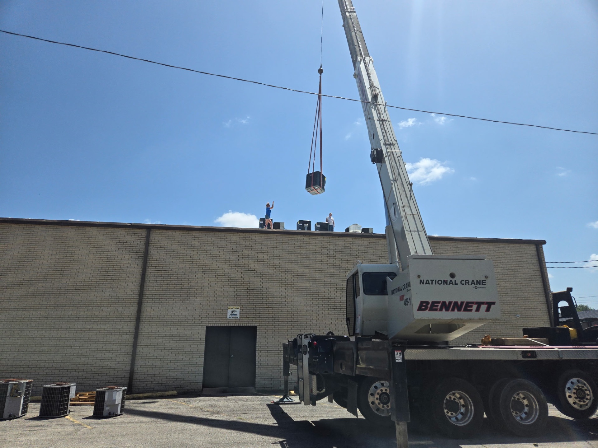 Bennett crane on-site for commercial rooftop unit replacement