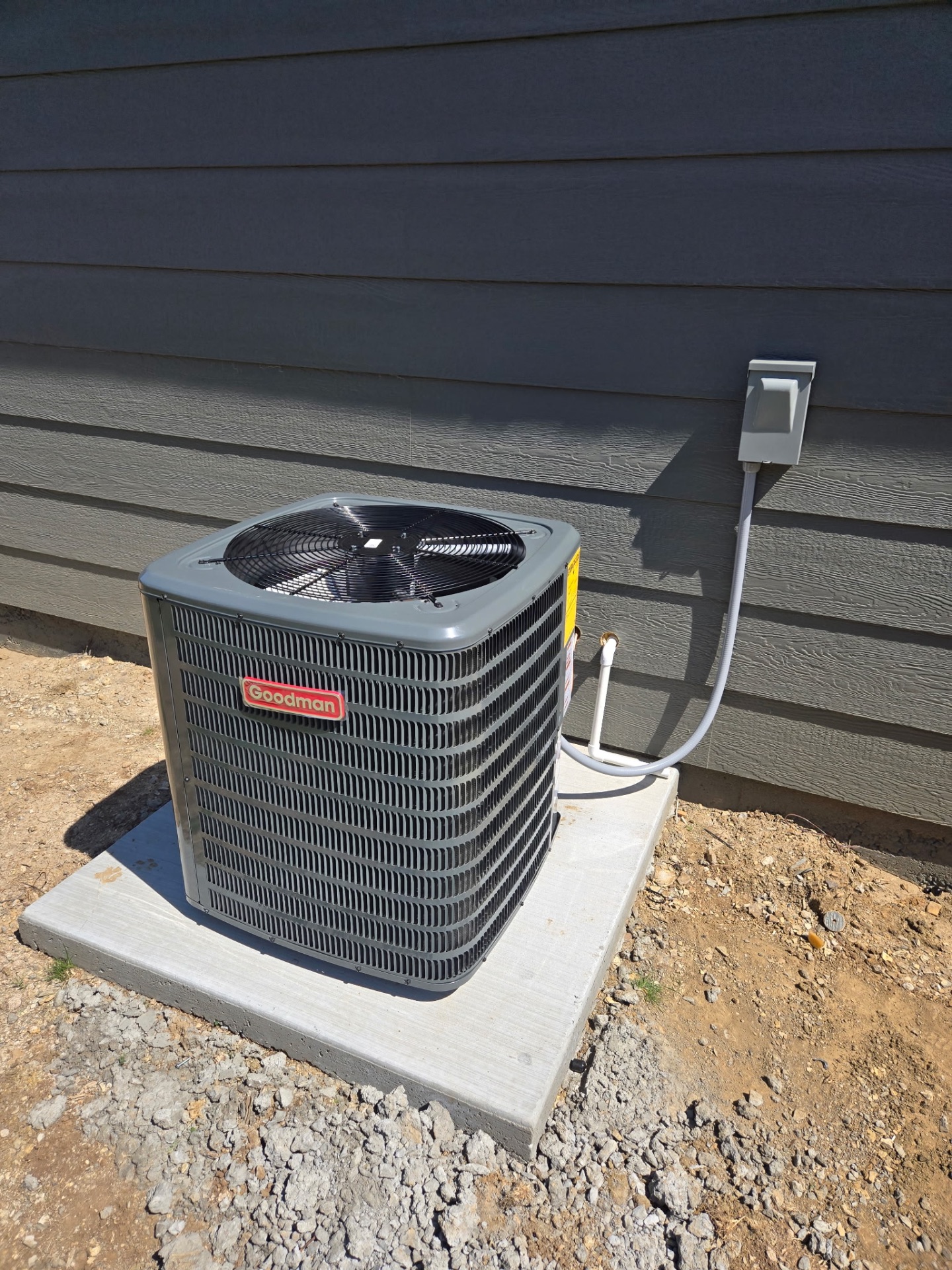 Clean Goodman condenser install with new disconnect and lineset